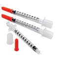 Three medical syringes.