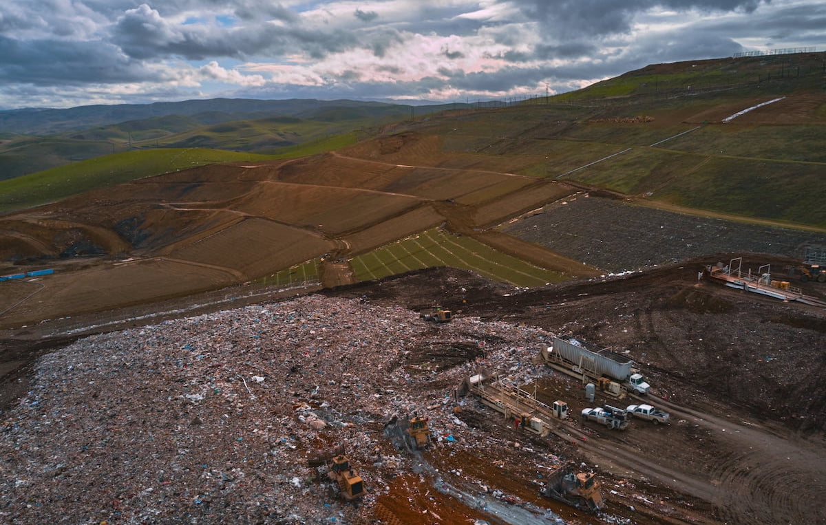 Aerial view of a WM landfill showing waste and early stages of engineering landfill for renewable energy.