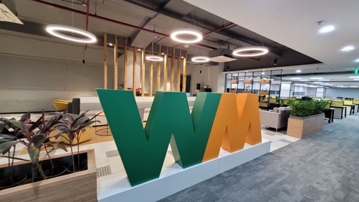 A common area featuring a large WM logo in a WM India office
