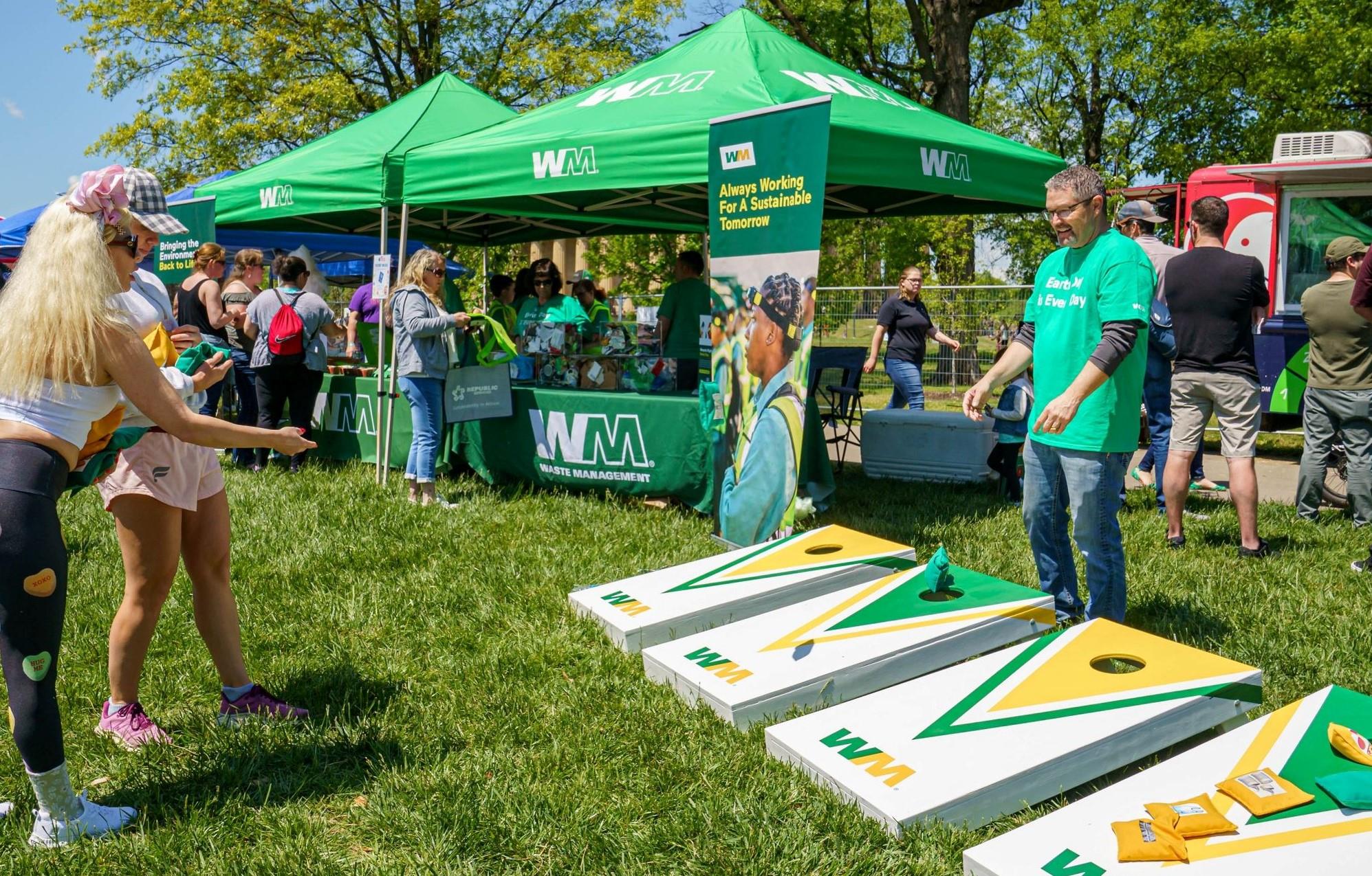WM team members playing the Will It Recycle bag toss game for Nashville Earth Day.