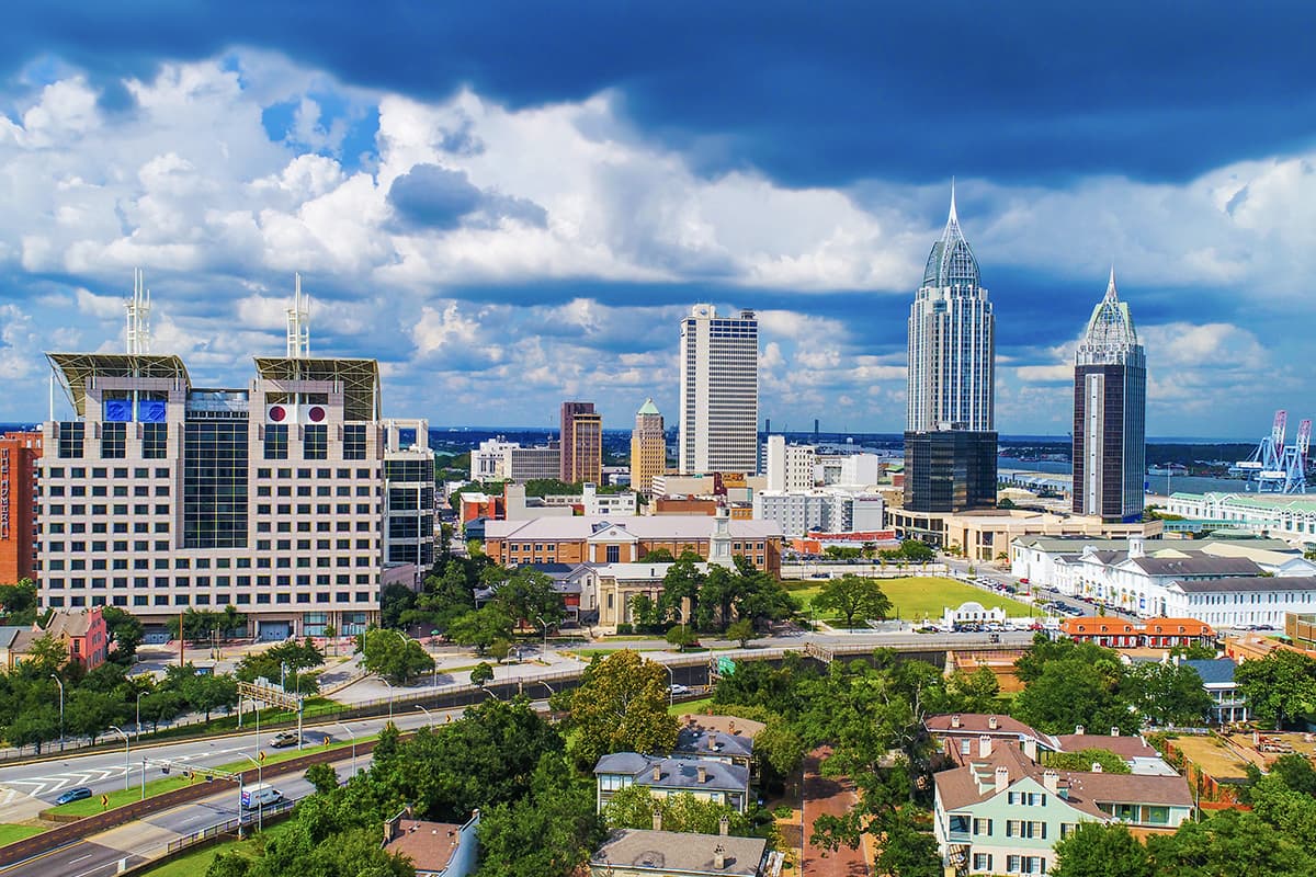 Mobile Alabama skyline. WM brings superior trash, dumpster and recycling services to Mobile.