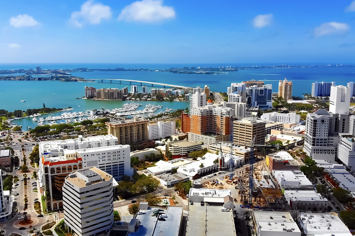 The Sarasota, FL skyline with a view of the bay in the background